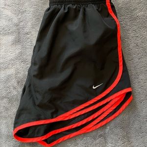 Nike athletic shorts with orange liner